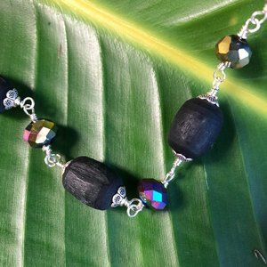 34  1/4" black Tulasi with bluish purple crystal glass beads
